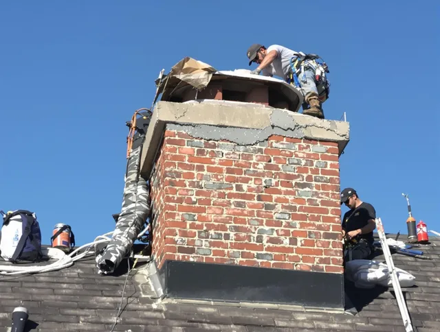 Griswold Chimney Sweep installing a custom chimney crown in Griswold, CT
