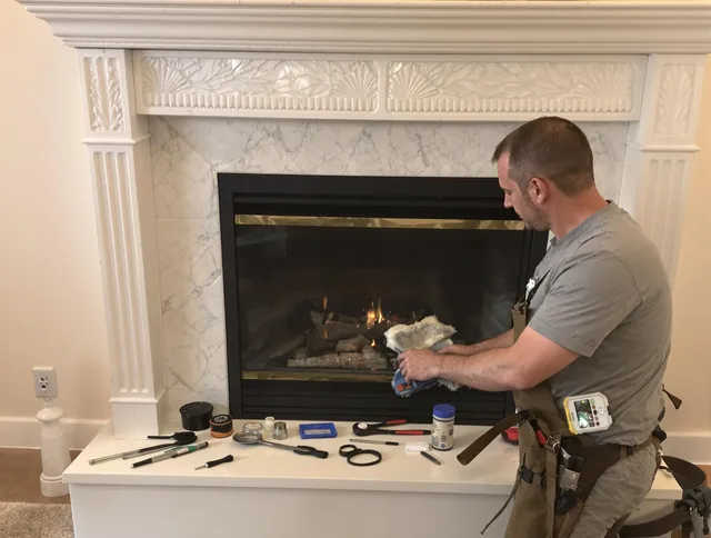 Griswold Chimney Sweep performing fireplace maintenance in Griswold, CT