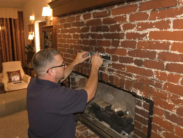 Griswold Chimney Sweep expert fixing a fireplace in Griswold, CT